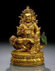 FINE AND RARE FIRE-GILT BRONZE VAISHRAVANA FINE AND RARE FIRE-GILT BRONZE VAISHRAVANA