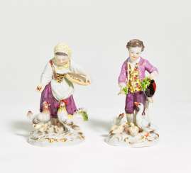 Porcelain figurines of girl feeding chicken and boy feeding geese Porcelain figurines of girl feeding chicken and boy feeding geese