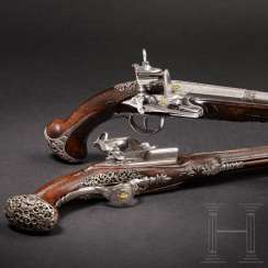A Pair of silver mounted Miquelet pistols, the North of Spain, at the end of 18. Century A Pair of silver mounted Miquelet pistols, the North of Spain, at the end of 18. Century