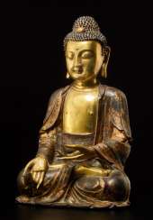 A PARTIALLY FIRE-GILT BRONZE OF THE MEDICINE BUDDHA, BHAISHAJYA-GURU A PARTIALLY FIRE-GILT BRONZE OF THE MEDICINE BUDDHA, BHAISHAJYA-GURU