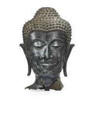 A BRONZE HEAD OF BUDDHA SHAKYAMUNI A BRONZE HEAD OF BUDDHA SHAKYAMUNI