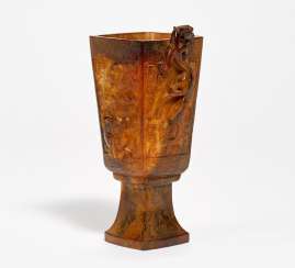 Archaic dragon cup made of jade Archaic dragon cup made of jade