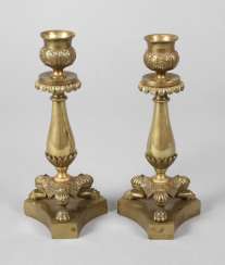 Pair of brass candlesticks in the classical style Pair of brass candlesticks in the classical style