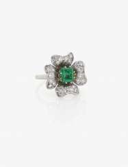 COCKAILRING DECORATED WITH AN EMERALD AND BRILLIANTS . USA, 1950s-1960s COCKAILRING DECORATED WITH AN EMERALD AND BRILLIANTS . USA, 1950s-1960s