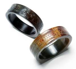 Two Jade bangles with animal and honeycomb decor Two Jade bangles with animal and honeycomb decor
