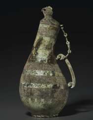 A RARE BRONZE RITUAL WINE VESSEL, HU A RARE BRONZE RITUAL WINE VESSEL, HU