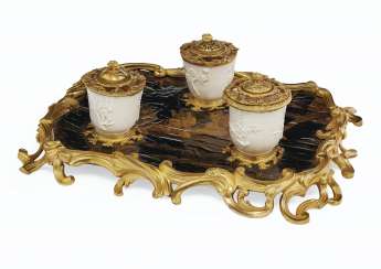 A LOUIS XV ORMOLU-MOUNTED BLACK AND GILT-LACQUER AND CHINESE DEHUA CUPS ENCRIER A LOUIS XV ORMOLU-MOUNTED BLACK AND GILT-LACQUER AND CHINESE DEHUA CUPS ENCRIER