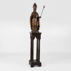 Large bishop figure on a high pedestal Large bishop figure on a high pedestal