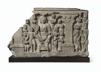 A GRAY SCHIST RELIEF WITH THE BODHISATTVA MAITREYA AND DEVOT... A GRAY SCHIST RELIEF WITH THE BODHISATTVA MAITREYA AND DEVOT...