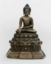 Bronze of Akshobhya on a throne with copper and silver deposits Bronze of Akshobhya on a throne with copper and silver deposits
