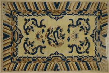 Important, imperial yellow carpet with five blue dragons Important, imperial yellow carpet with five blue dragons