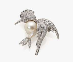 Fancy bird brooch with diamonds, rubies and a sapphire Fancy bird brooch with diamonds, rubies and a sapphire