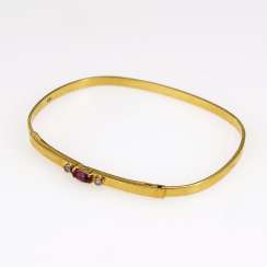 A modern bangle bracelet with ruby and diamonds A modern bangle bracelet with ruby and diamonds