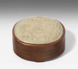 Jade medallion on lid of box Jade medallion on lid of box