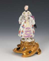 Courtesan on a bronze pedestal, Meissen. Courtesan on a bronze pedestal, Meissen.