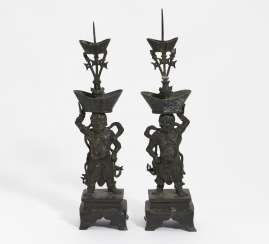 Pair of guardian figures as candlesticks Pair of guardian figures as candlesticks