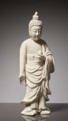 EARLY BLANC DE CHINE FIGURE OF A STANDING BUDDHA WITH LOTUS FLOWER EARLY BLANC DE CHINE FIGURE OF A STANDING BUDDHA WITH LOTUS FLOWER