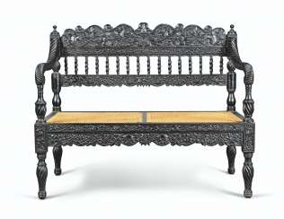 A CEYLONESE EBONY AND EBONISED SMALL SOFA A CEYLONESE EBONY AND EBONISED SMALL SOFA