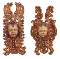 Pair of large cherub heads Pair of large cherub heads
