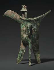 A RARE BRONZE RITUAL TRIPOD WINE VESSEL, JUE A RARE BRONZE RITUAL TRIPOD WINE VESSEL, JUE