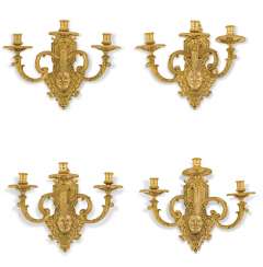 A SET OF FOUR FRENCH ORMOLU THREE-LIGHT WALL-APPLIQUES A SET OF FOUR FRENCH ORMOLU THREE-LIGHT WALL-APPLIQUES