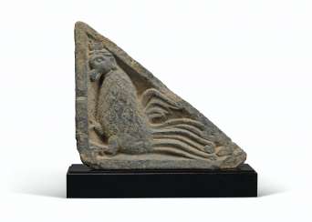A GRAY SCHIST STAIR-RISER RELIEF OF A MYTHICAL BEAST A GRAY SCHIST STAIR-RISER RELIEF OF A MYTHICAL BEAST