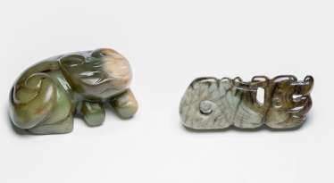 Jade pendant in the Form of a stylized dragon, and a carving of a horned animal Jade pendant in the Form of a stylized dragon, and a carving of a horned animal