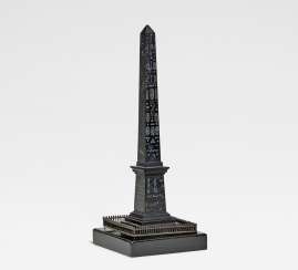Small bronze Luxor obelisk at the Place de la Concorde in Paris Small bronze Luxor obelisk at the Place de la Concorde in Paris