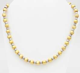 Necklace yellow gold / 18 K white gold with small diamonds in the front part. Necklace yellow gold / 18 K white gold with small diamonds in the front part.