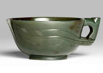 Dark green Jade drinking vessel in the Form of a peach Dark green Jade drinking vessel in the Form of a peach