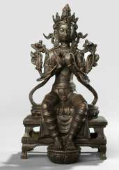 A Bronze sculpture of a Maitreya sitting on a throne A Bronze sculpture of a Maitreya sitting on a throne