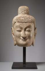 LARGE HEAD OF A SMILING BUDDHA LARGE HEAD OF A SMILING BUDDHA