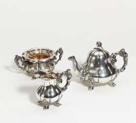 Three-piece silver coffee service with figural handles Three-piece silver coffee service with figural handles