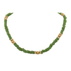 Designer necklace made of green glass beads in the shape of a disc, Designer necklace made of green glass beads in the shape of a disc,