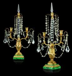 A PAIR OF FRENCH ORMOLU, CUT-GLASS, AND MALACHITE TWIN-LIGHT CANDELABRA A PAIR OF FRENCH ORMOLU, CUT-GLASS, AND MALACHITE TWIN-LIGHT CANDELABRA