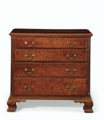 A CHIPPENDALE CARVED CHERRYWOOD CHEST-OF-DRAWERS A CHIPPENDALE CARVED CHERRYWOOD CHEST-OF-DRAWERS
