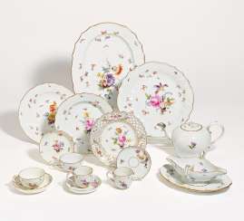 70 pieces from a service with flower and insect decoration 70 pieces from a service with flower and insect decoration