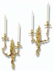 A NEAR PAIR OF LOUIS XV ORMOLU TWO-BRANCH WALL-LIGHTS A NEAR PAIR OF LOUIS XV ORMOLU TWO-BRANCH WALL-LIGHTS