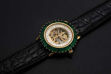 AUDEMARS PIGUET, A LADIES GOLD WRISTWATCH SET WITH EMERALDS, DIAMONDS, AND A SKELETONISED DIAL, ENGRAVED NO. 1 AUDEMARS PIGUET, A LADIES GOLD WRISTWATCH SET WITH EMERALDS, DIAMONDS, AND A SKELETONISED DIAL, ENGRAVED NO. 1