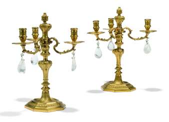A PAIR OF FRENCH ORMOLU AND ROCK-CRYSTAL THREE-LIGHT CANDELABRA A PAIR OF FRENCH ORMOLU AND ROCK-CRYSTAL THREE-LIGHT CANDELABRA
