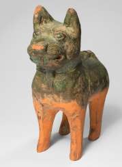Earthenware model of a standing dog with green lead-silicate glaze Earthenware model of a standing dog with green lead-silicate glaze