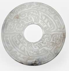 'Bi'disc made of white Jade with an abstract 'Taotie'decor 'Bi'disc made of white Jade with an abstract 'Taotie'decor