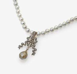 Cultured pearl necklace with bow shaped pendant Cultured pearl necklace with bow shaped pendant