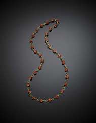Long yellow gold and orange coral bead necklace Long yellow gold and orange coral bead necklace