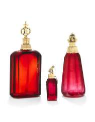 A GROUP OF THREE GERMAN SILVER-GILT AND GILT-METAL MOUNTED RUBY-GLASS SCENT BOTTLES A GROUP OF THREE GERMAN SILVER-GILT AND GILT-METAL MOUNTED RUBY-GLASS SCENT BOTTLES