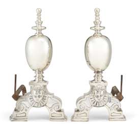 A PAIR OF BAROQUE STYLE SILVERED ANDIRONS A PAIR OF BAROQUE STYLE SILVERED ANDIRONS