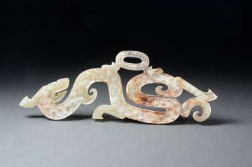SPIRAL HORNED DRAGON WITH A YOUNG COUNTERPART TO THE FAMOUS DRAGON AMULET AT THE MUSÉE GUIMET SPIRAL HORNED DRAGON WITH A YOUNG COUNTERPART TO THE FAMOUS DRAGON AMULET AT THE MUSÉE GUIMET