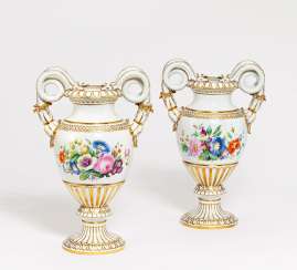 Pair of snake handle vases with bouquets of flowers Pair of snake handle vases with bouquets of flowers