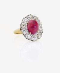 ENTOURAGE RING DECORATED WITH A RUBY AND DIAMONDS ENTOURAGE RING DECORATED WITH A RUBY AND DIAMONDS