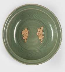 Rare large celadon bowl with unglazed pair of figures in the mirror Rare large celadon bowl with unglazed pair of figures in the mirror